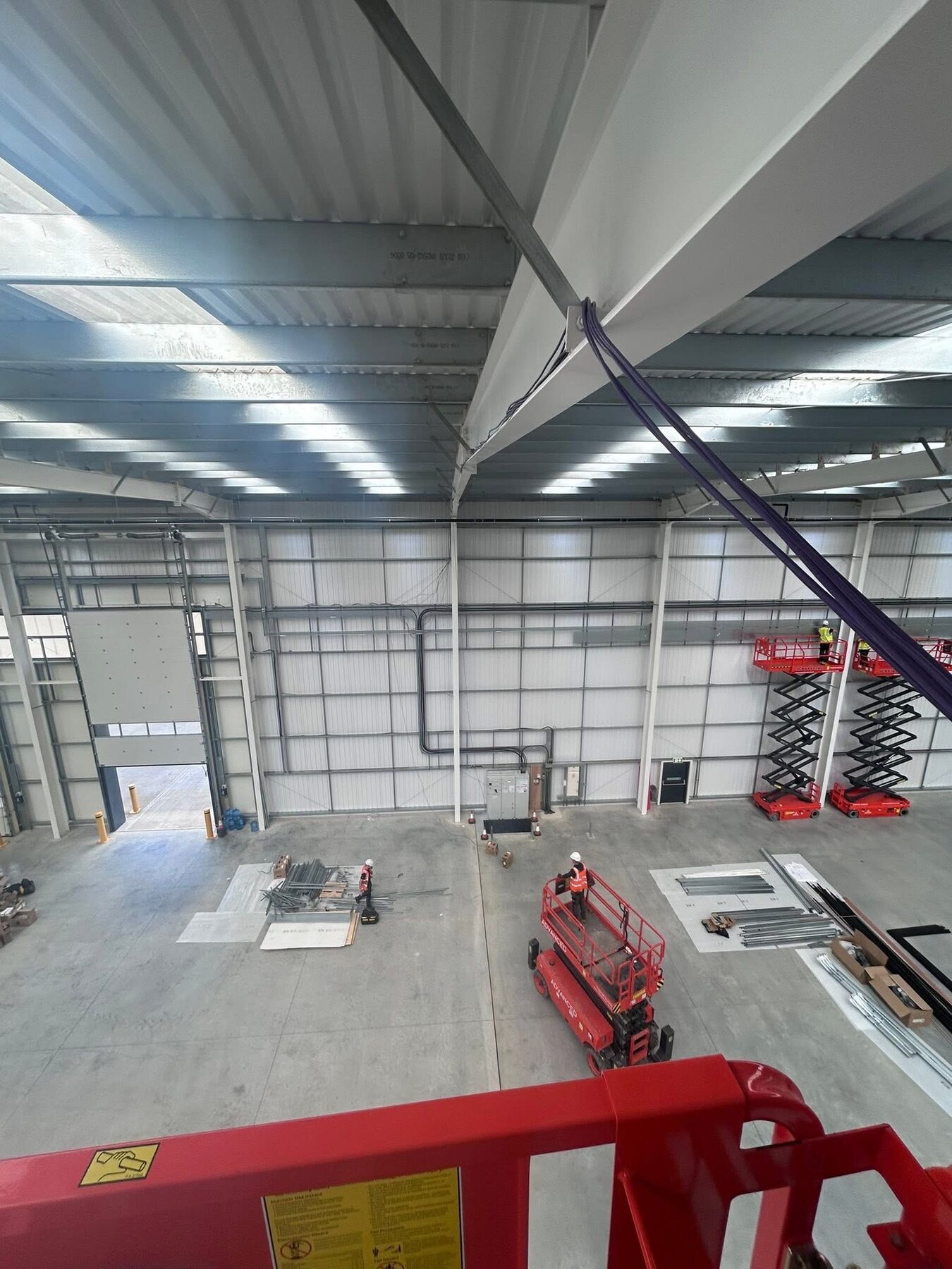 High-level cabling installation on a large industrial site